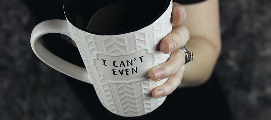 A person holds a coffee mug.