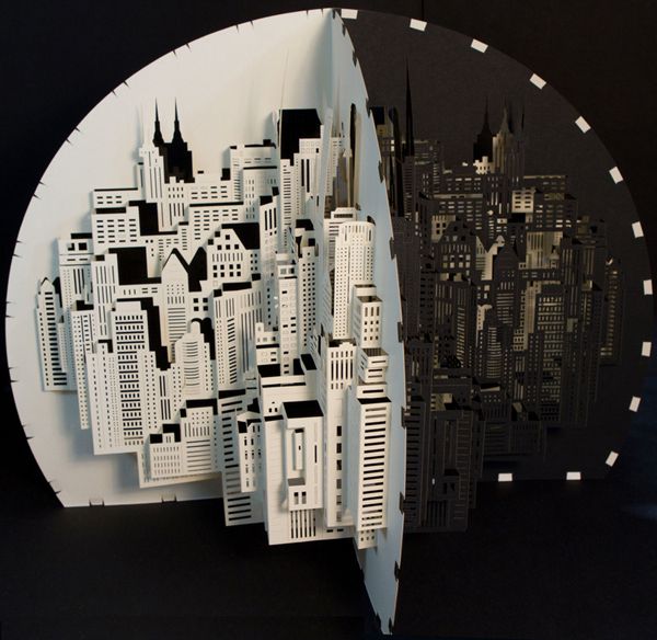 papercraft sculpture of a fold out cityscape by Ingrid Siliakus