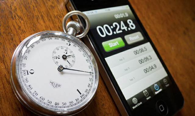 vintage stopwatch next to iPhone stopwatch app
